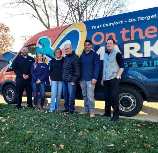 An On the Mark technician diagnosing a furnace in a Schaumburg home
