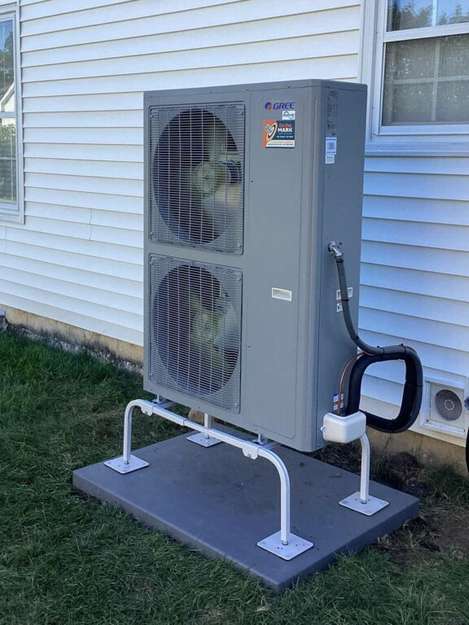 A newly serviced heat pump outside a Schaumburg home