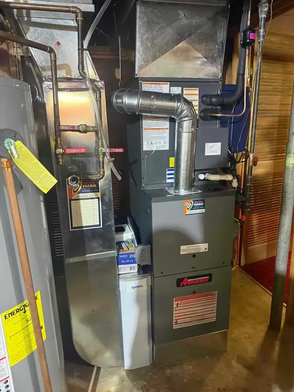 A newly installed high-efficiency furnace in a residential utility room