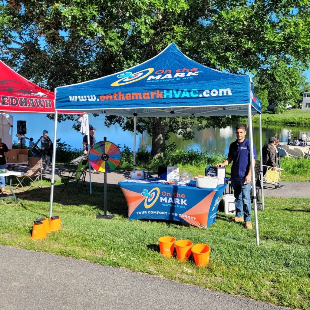 On the Mark booth at the Annual Fishing Derby in Hoffman Estates