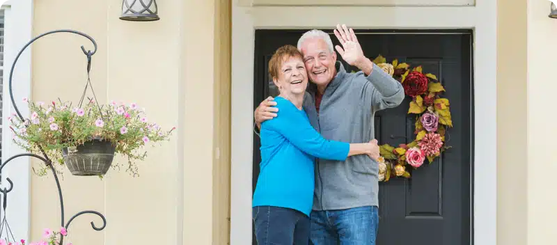 Satisfied On the Mark customers waving goodbye after service